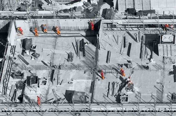 Construction workers on a building site, representing a business building a virtual desktop infrastructure.