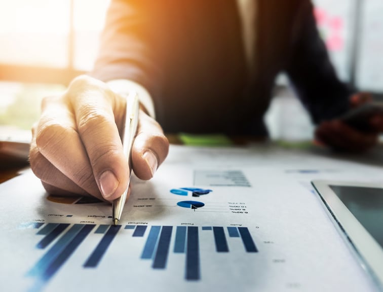 Investor-reading-financial-charts