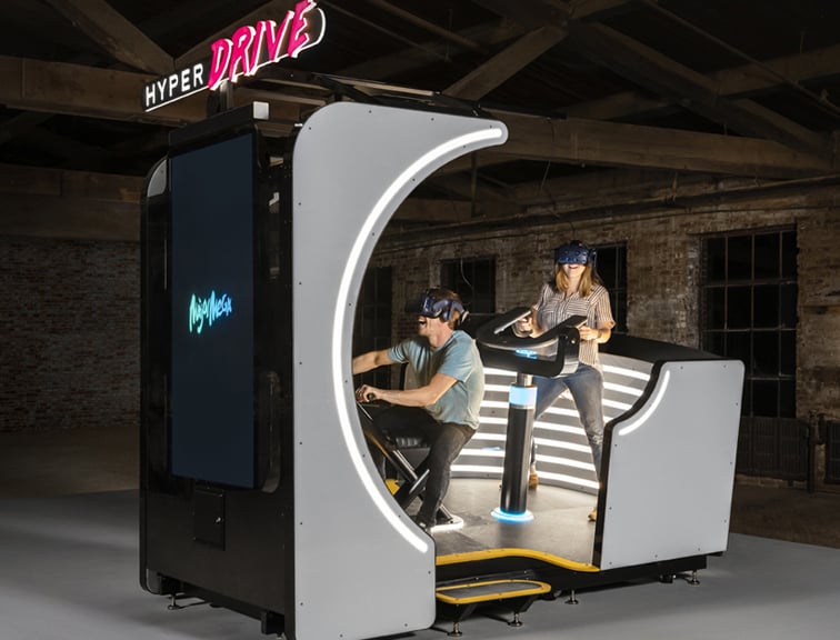 A-pair-enjoying-a-D-BOX-immersive-haptic-attraction