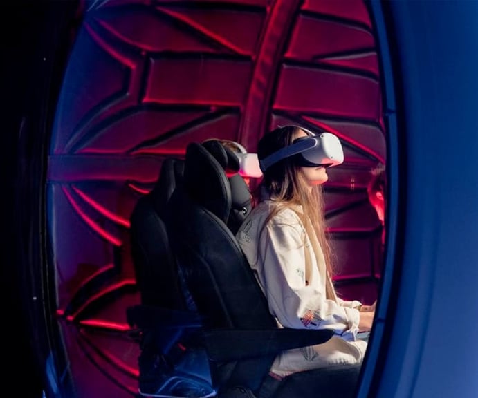 Four people enjoy a VR immersive haptic experience