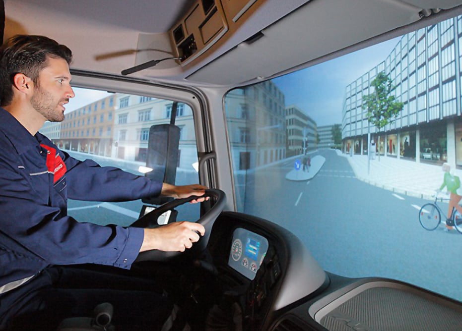 Man-using-D-BOX-heavy-vehicle-professional-simulator