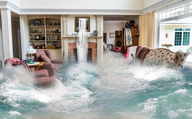 Flooded living room needing water restoration