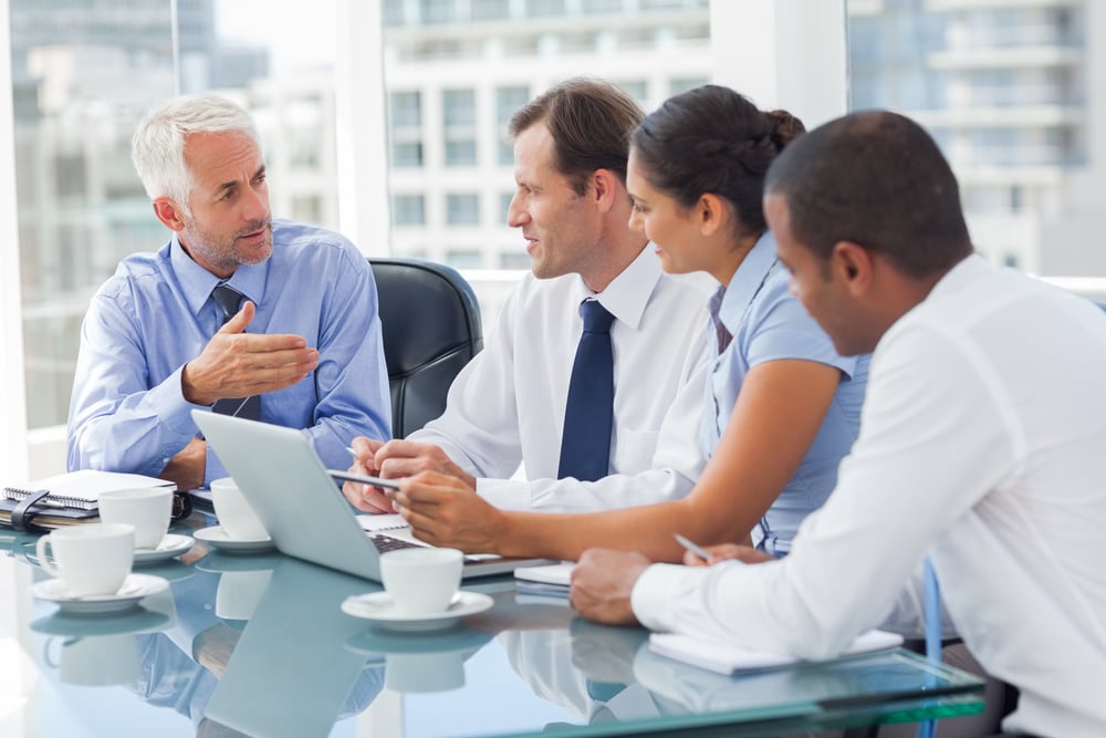 Group of business people brainstorming together in the meeting room-1