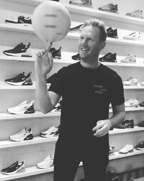 Paul Taylor in a shoe shop, spinning a basketball on his finger