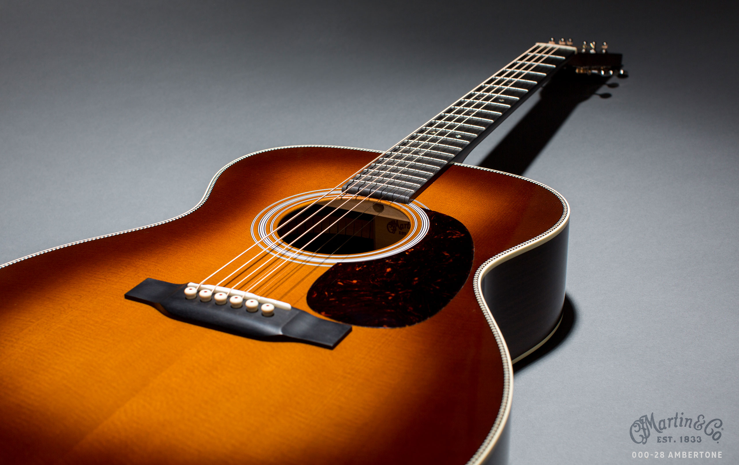 Black Acoustic Guitar Leaning on the White Wall · Free Stock Photo