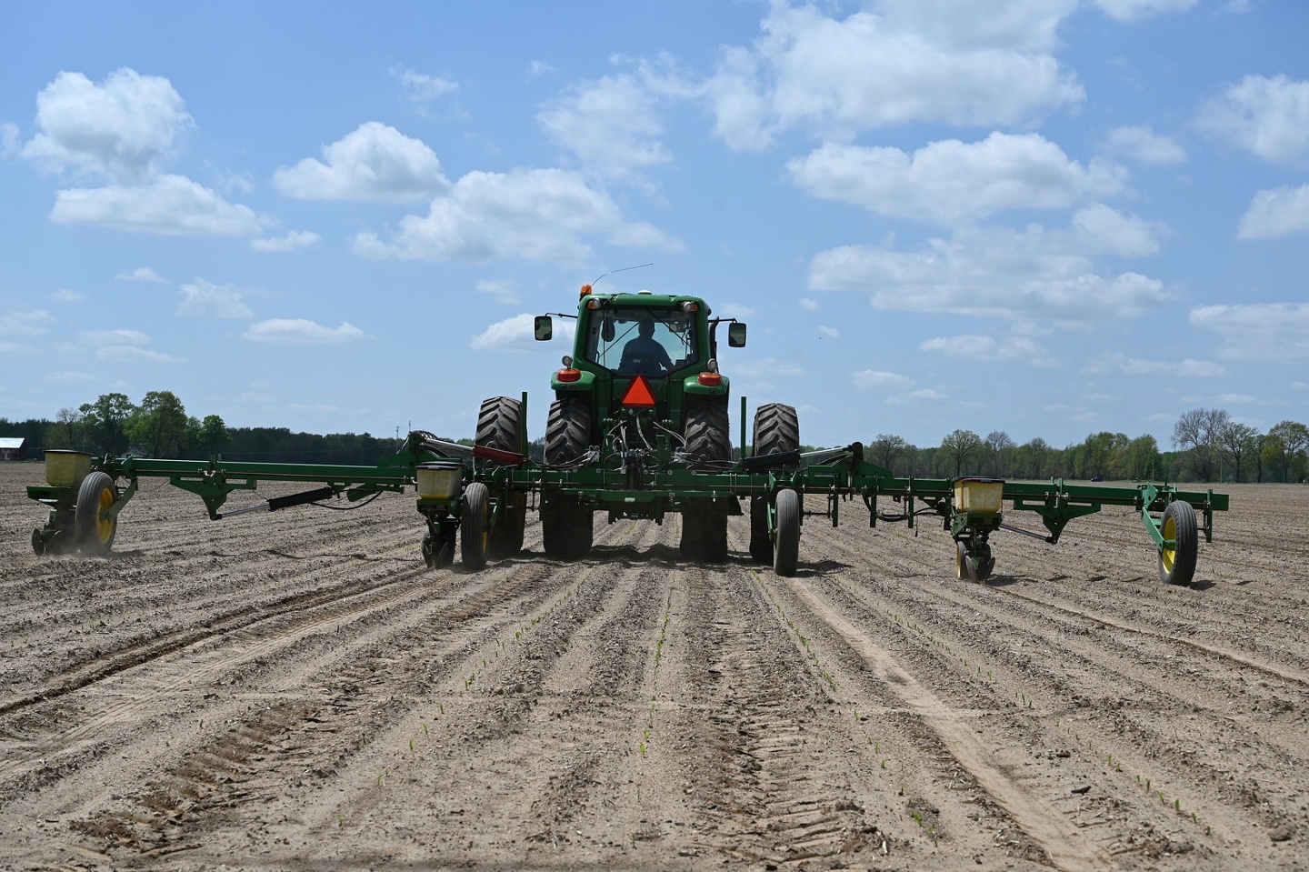 Tractor working the soil of a field