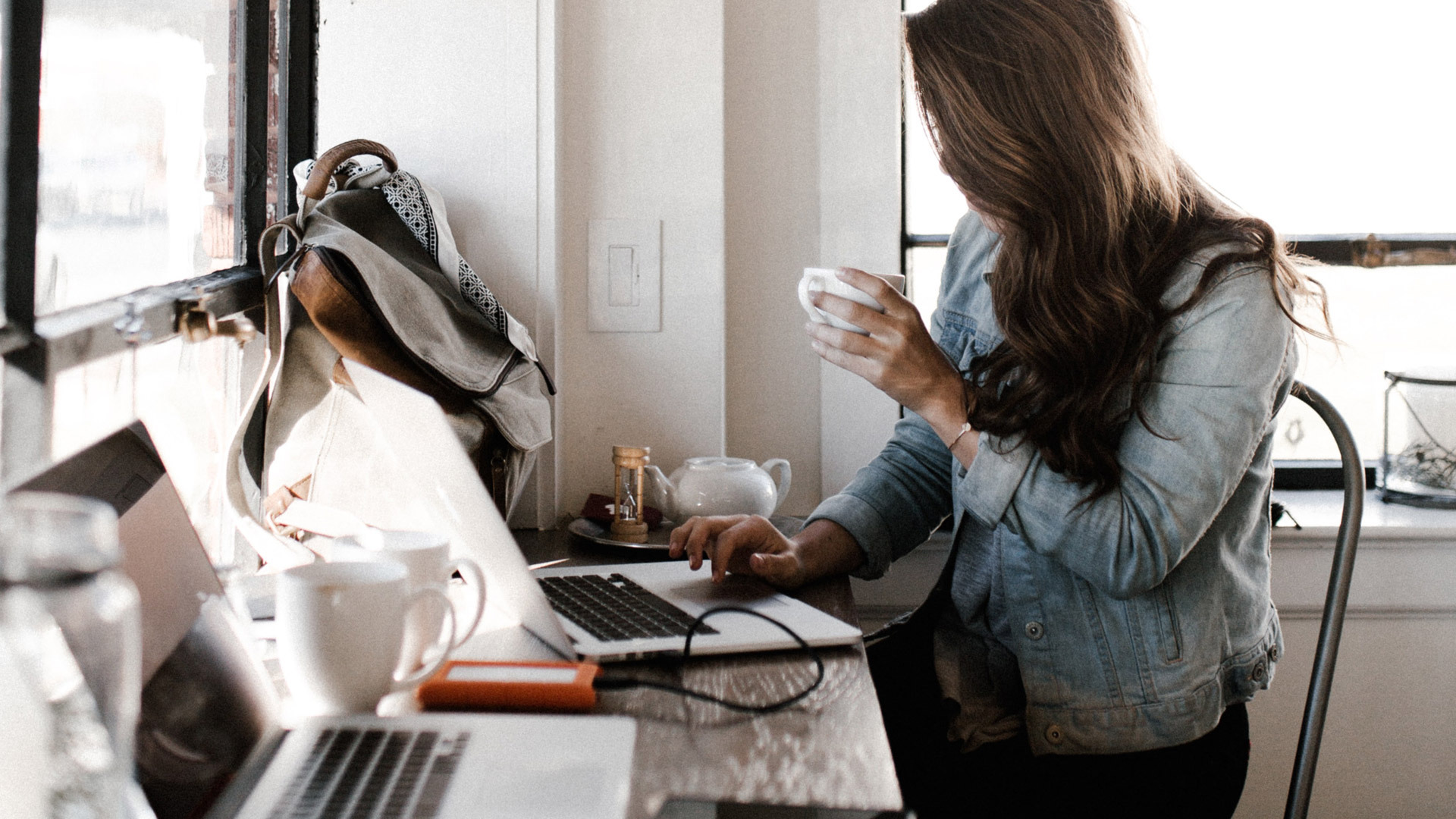Woman writing an indie film pitch