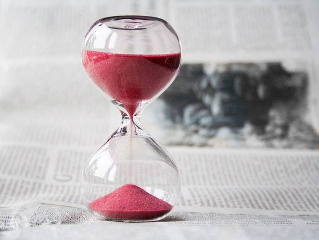 Clear hourglass with red sand