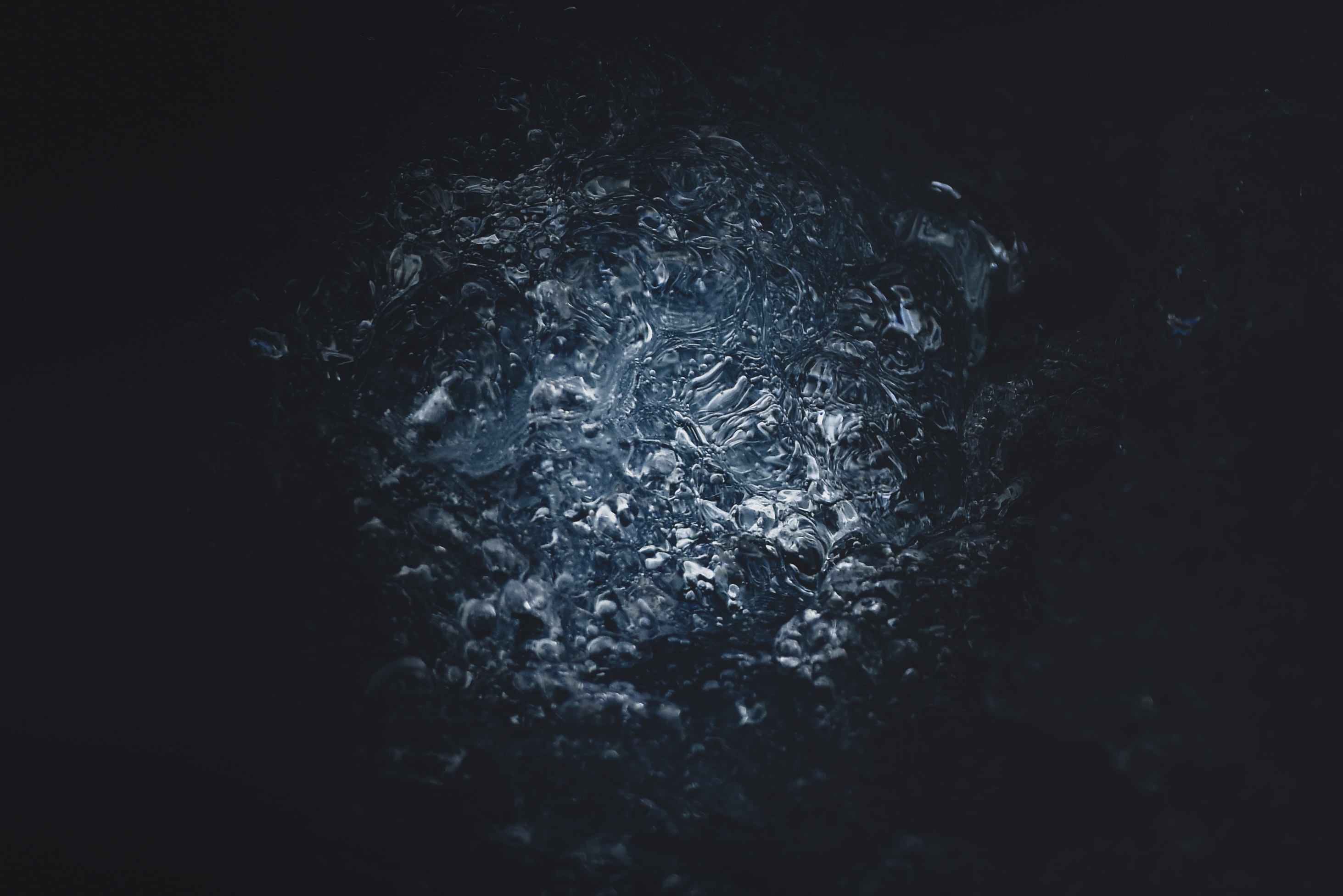 Dark background with water