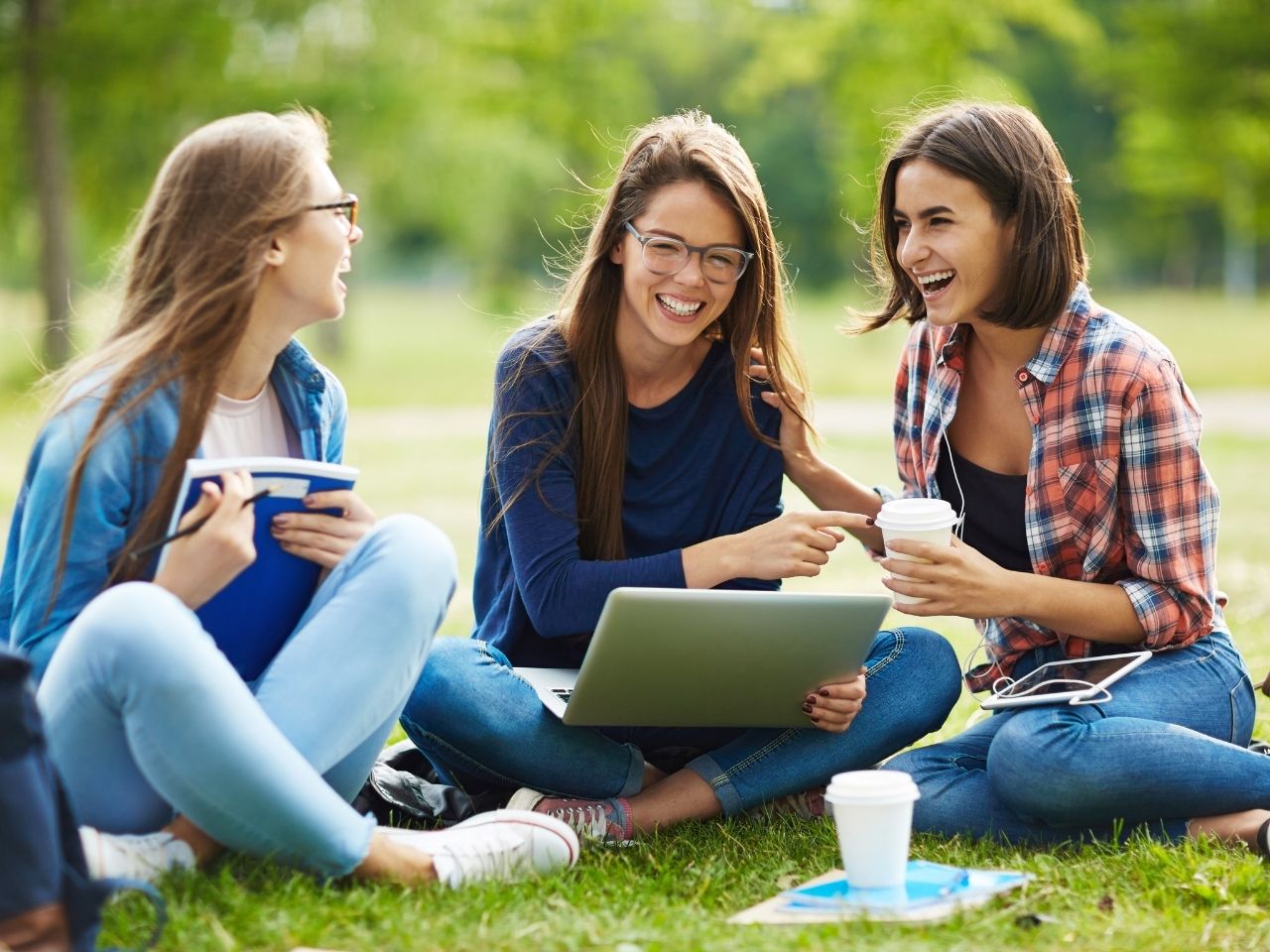 Girls laughing on lawn