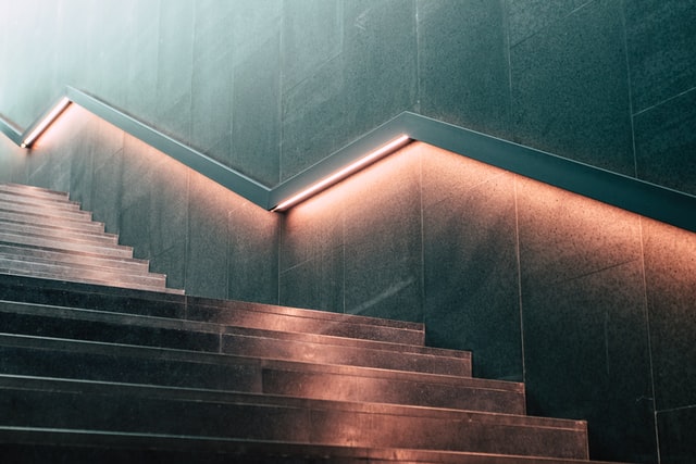 Gray and orange light staircase
