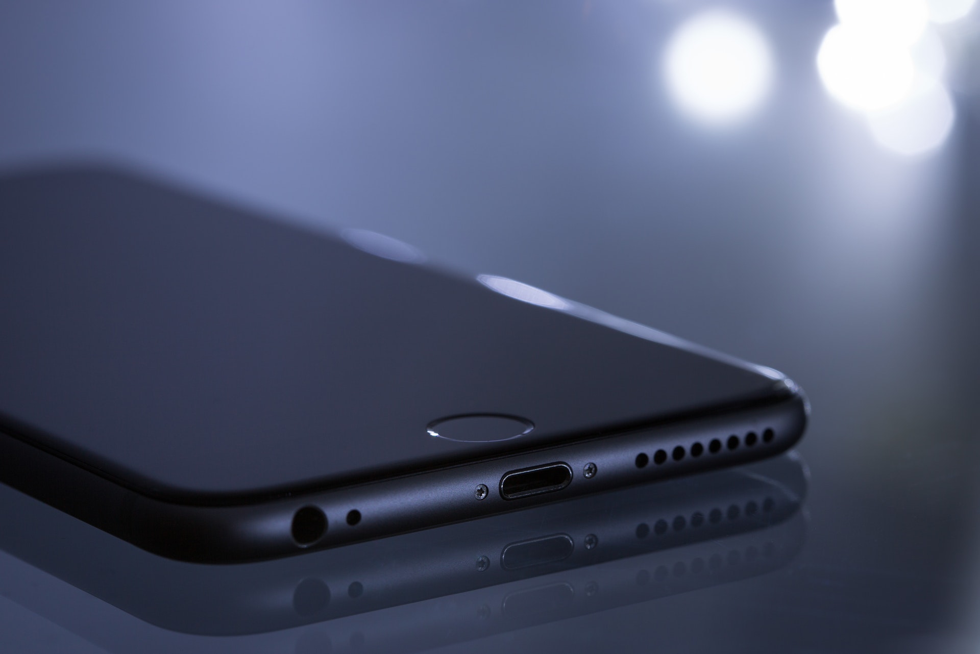 Gray iPhone on dark background