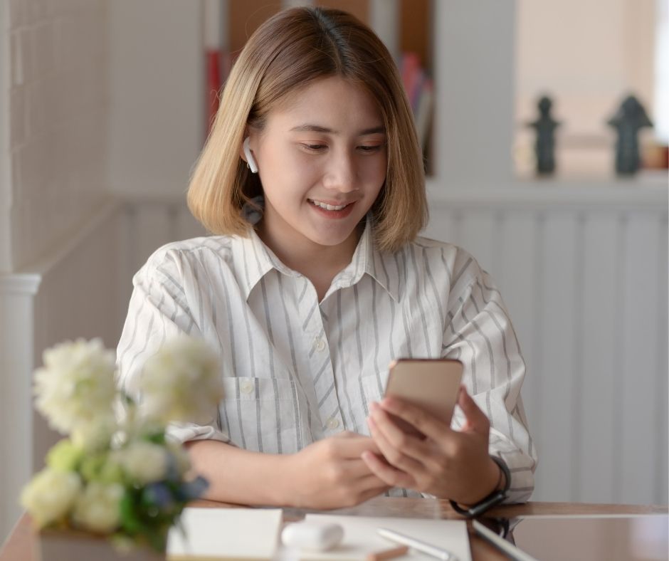 Happy girl looking at phone