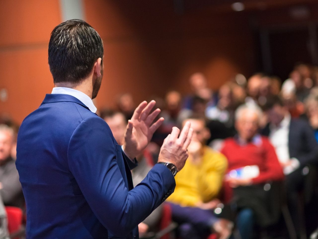 Man explaining to an audience