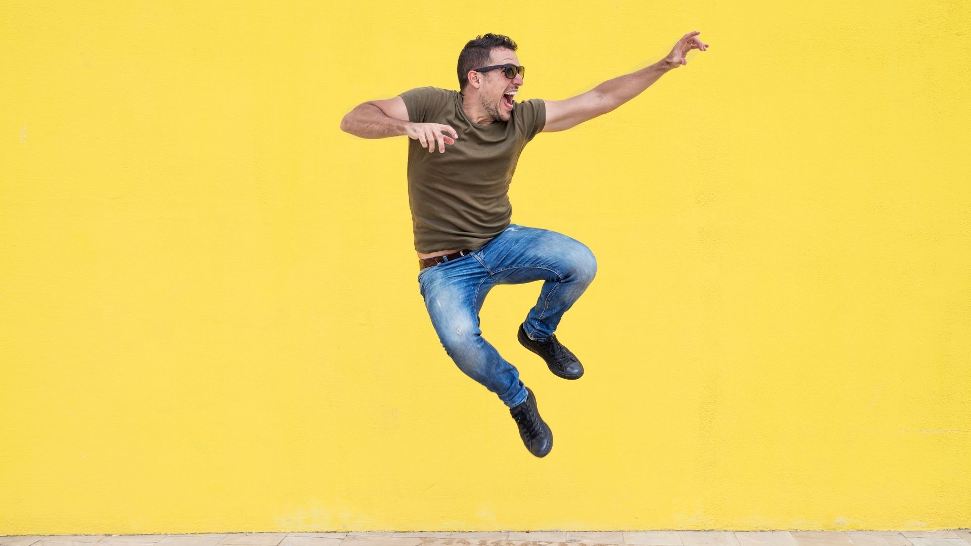Man jumping on a yellow background