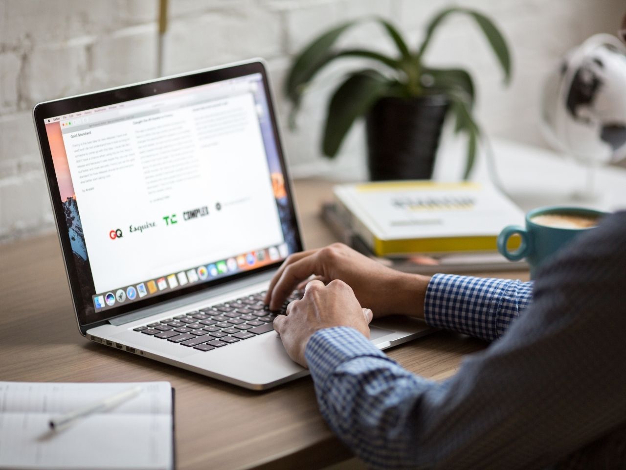 Man on a laptop drinking coffee