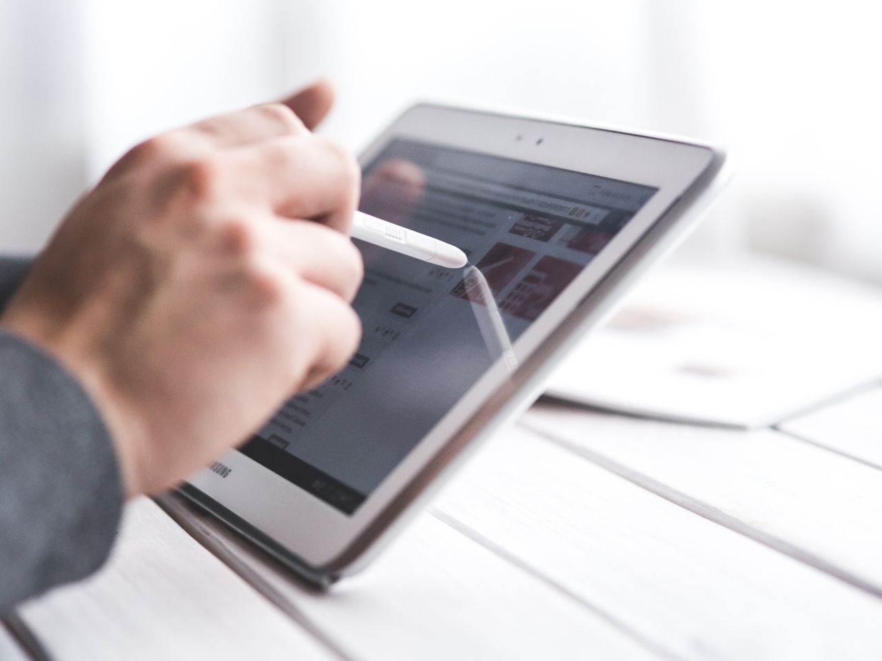 Man using a pen on a tablet