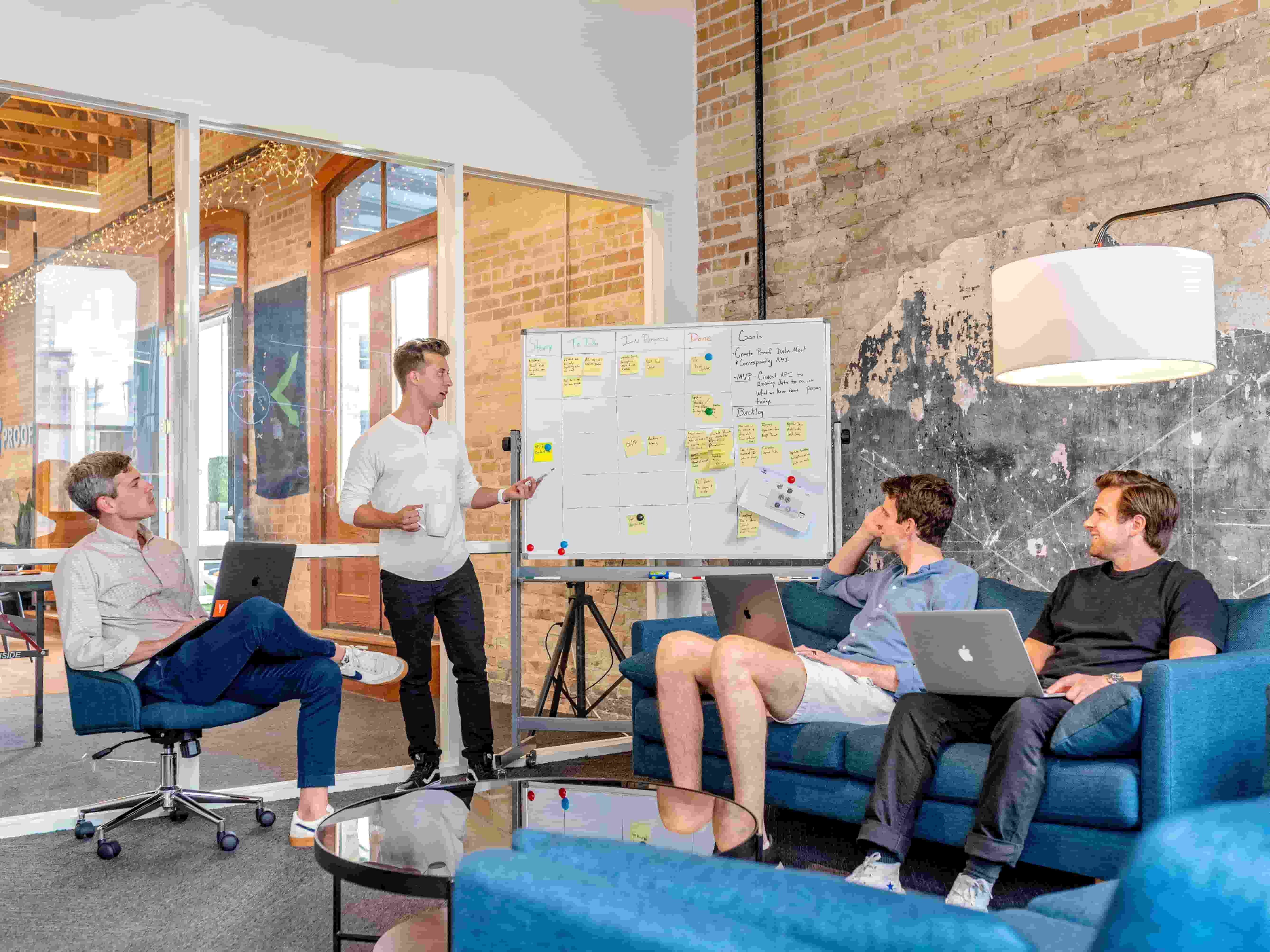 Meeting of people around whiteboard