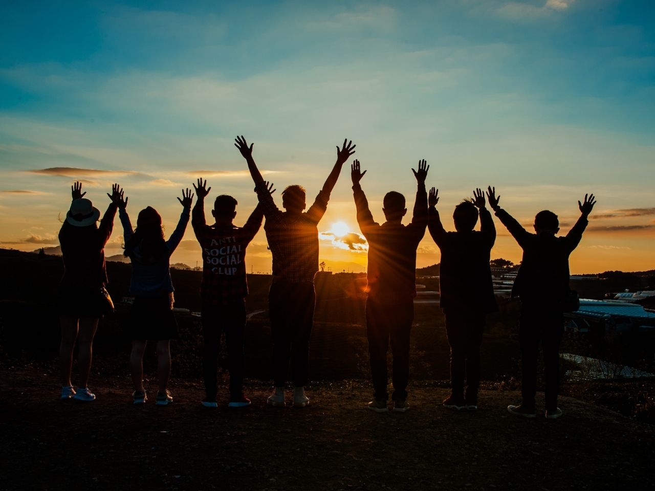 People staring at sunset