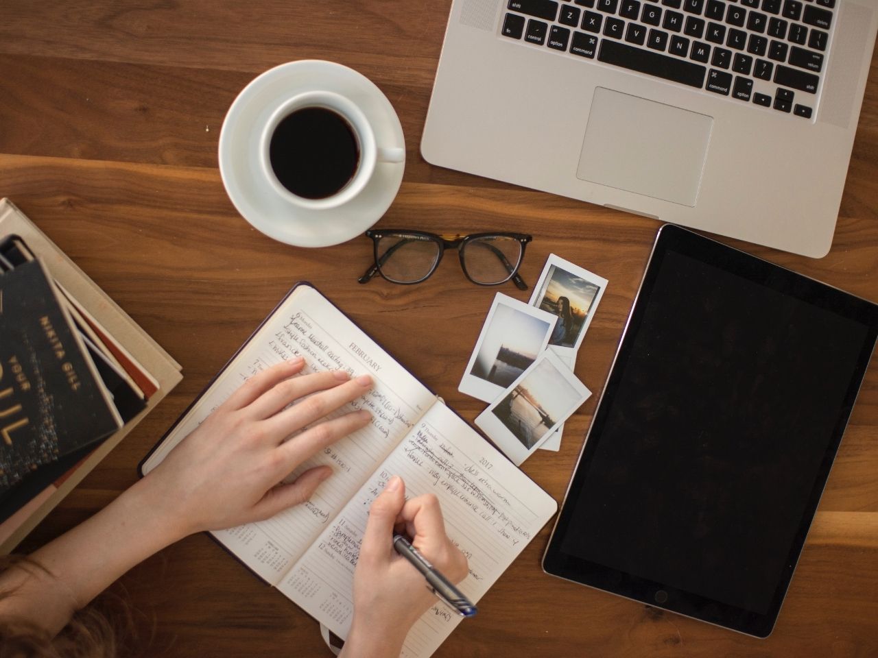 Woman writing on a notebook