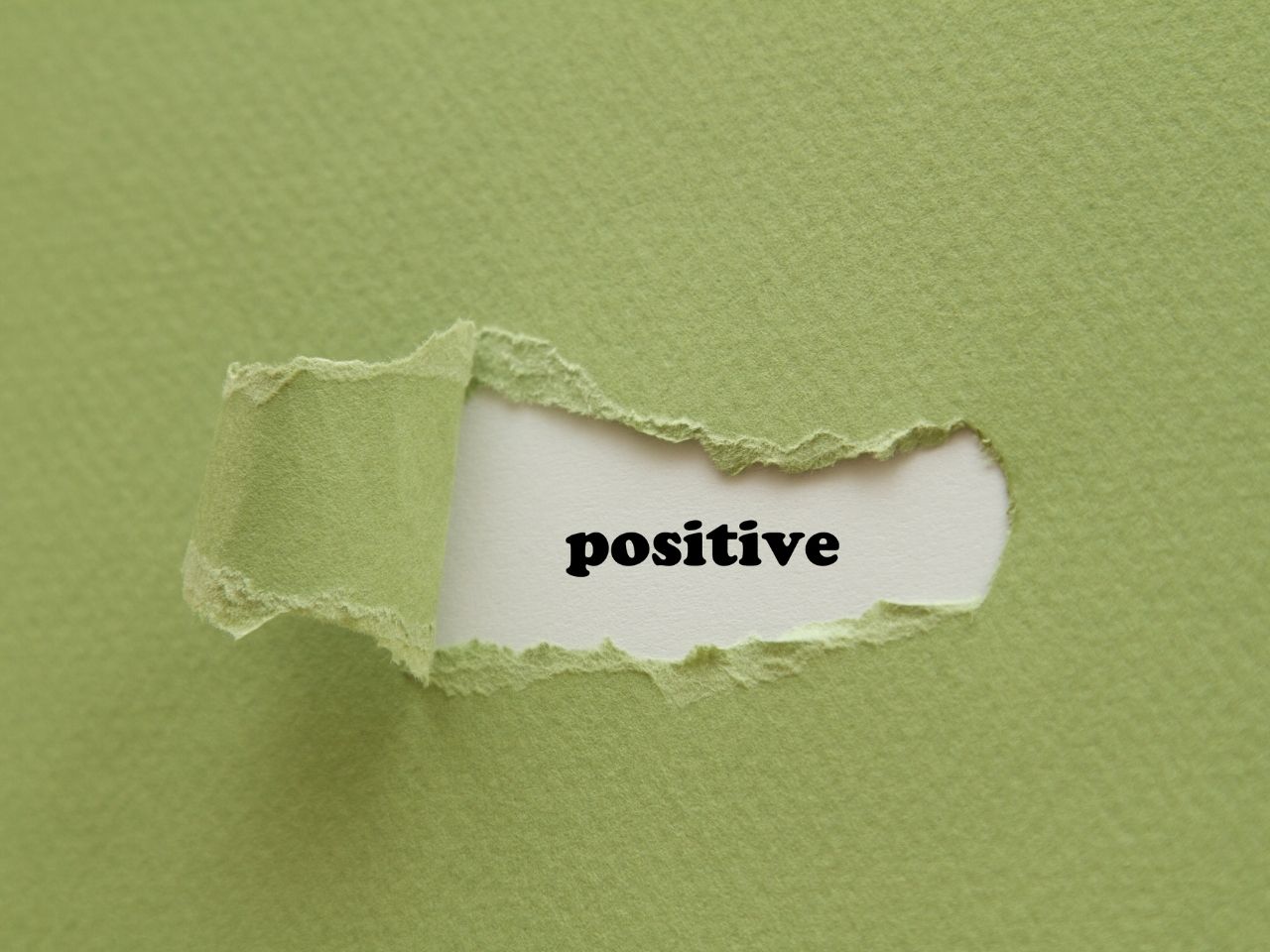 Positive word on green background