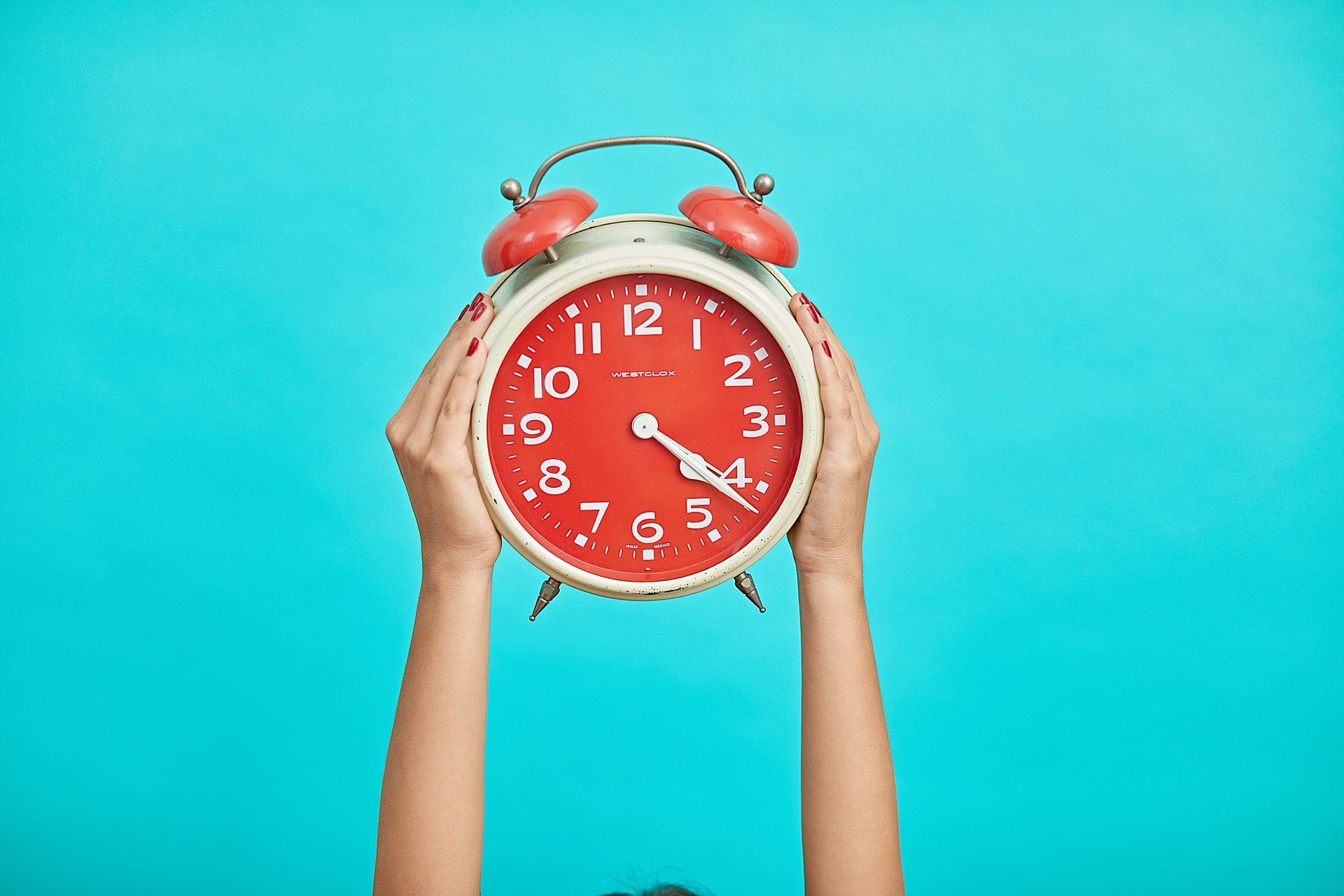 Red clock on a blue background