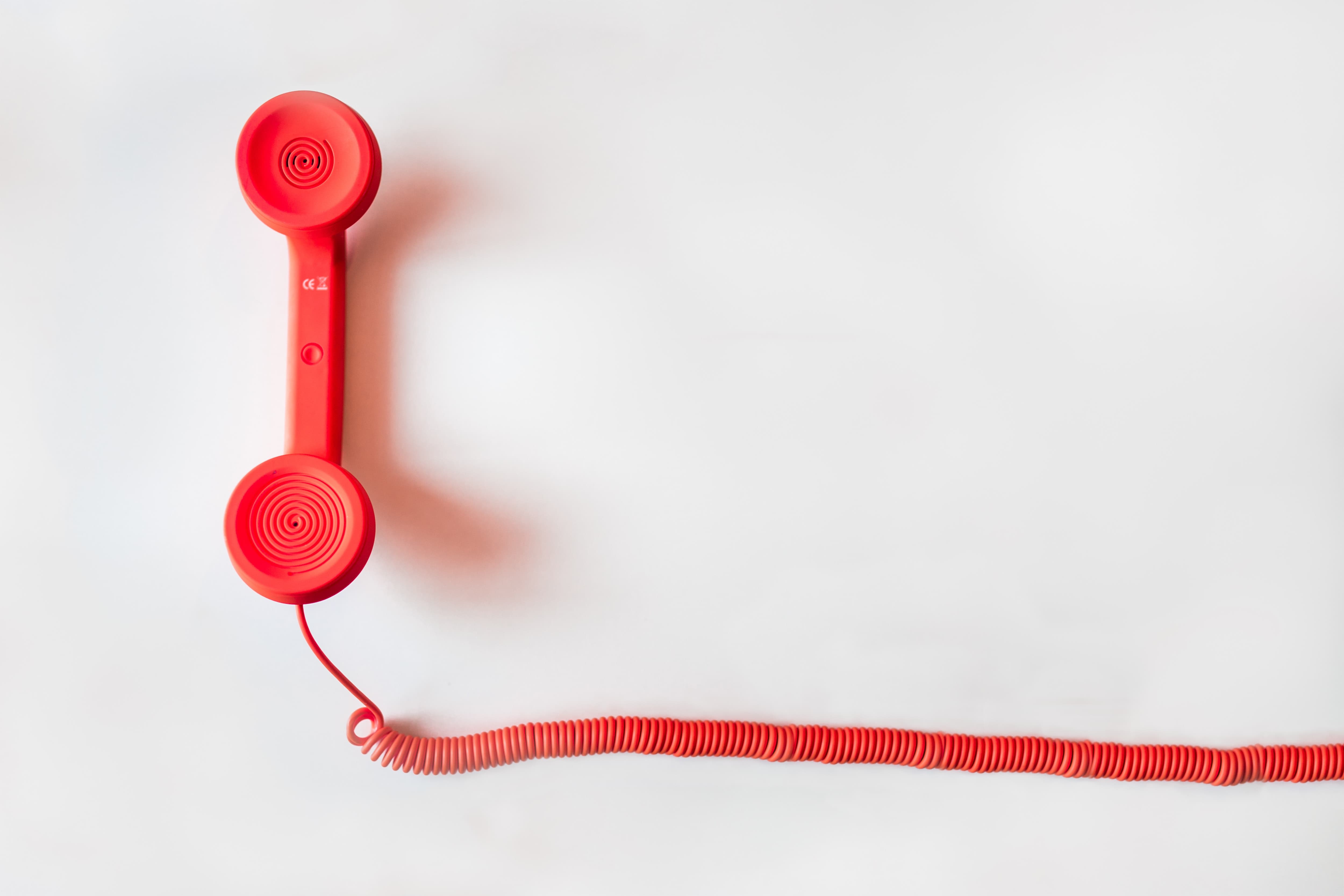 Red telephone on cord