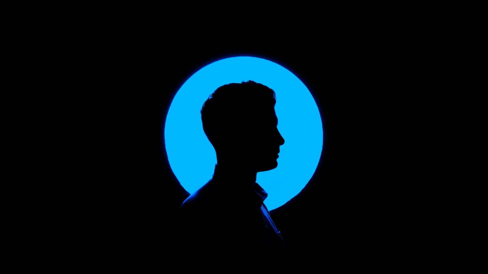 Silhouette of a man on a blue background