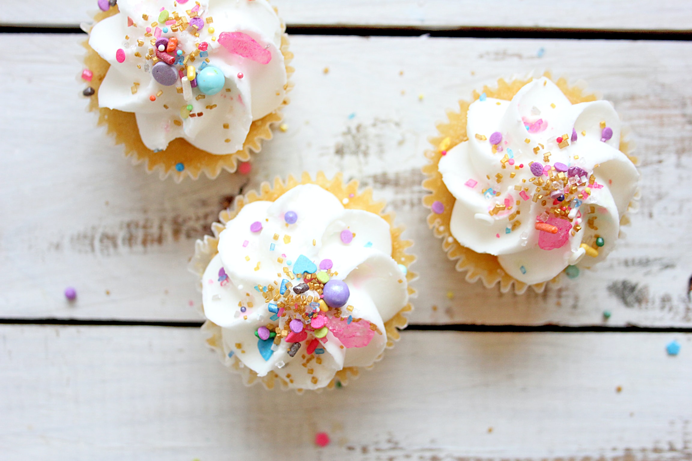 Colorful cupcakes on counter