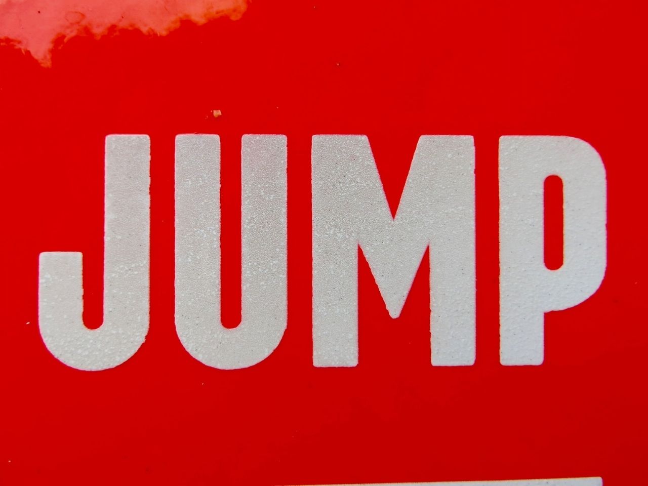 White word Jump on red background