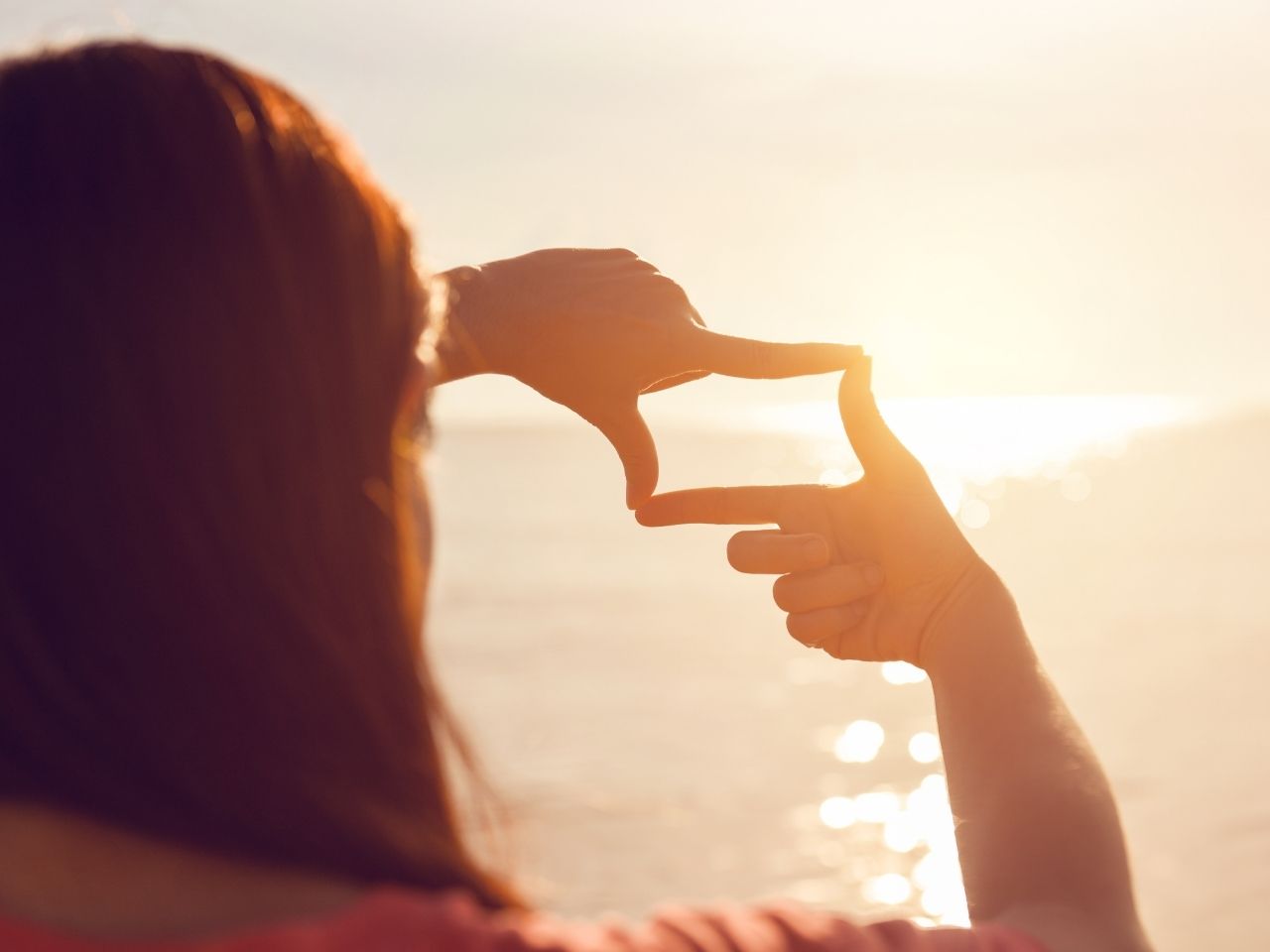 Woman picturing the sunrise