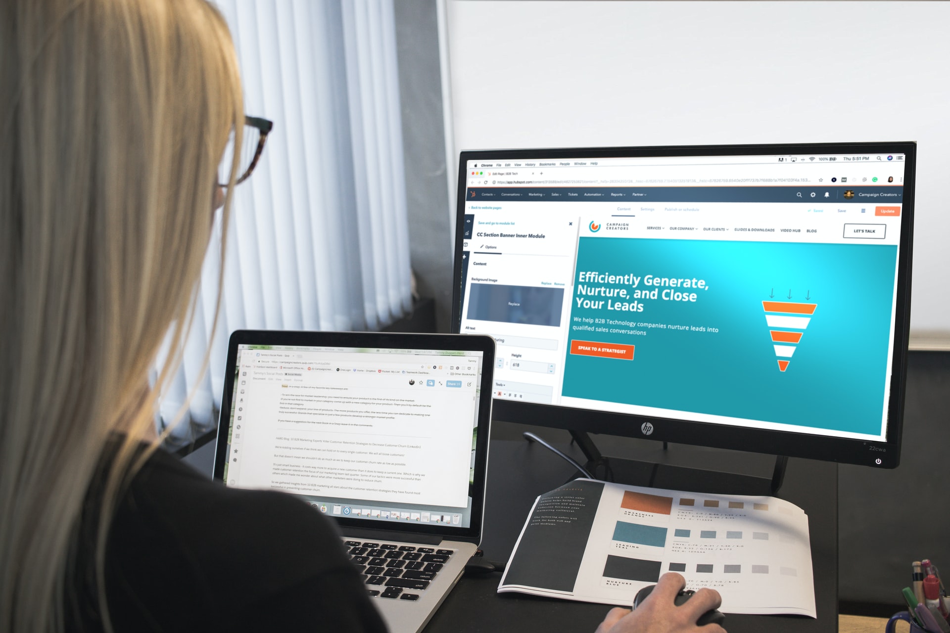 Woman sitting in front of computer with Hubspot