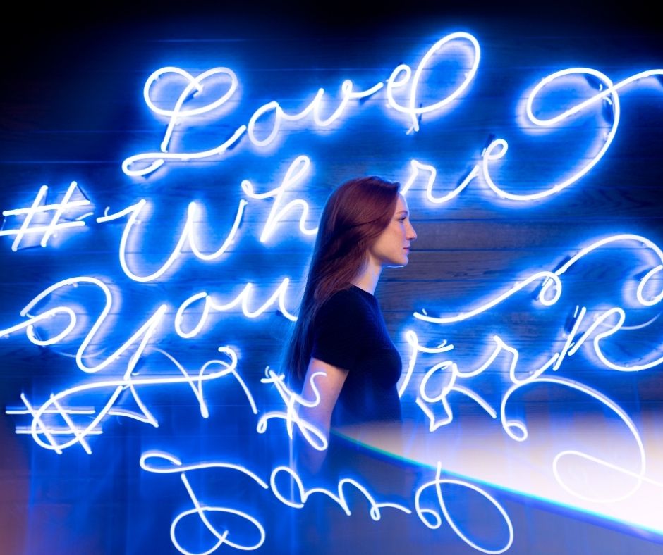Woman standing in hashtag lights
