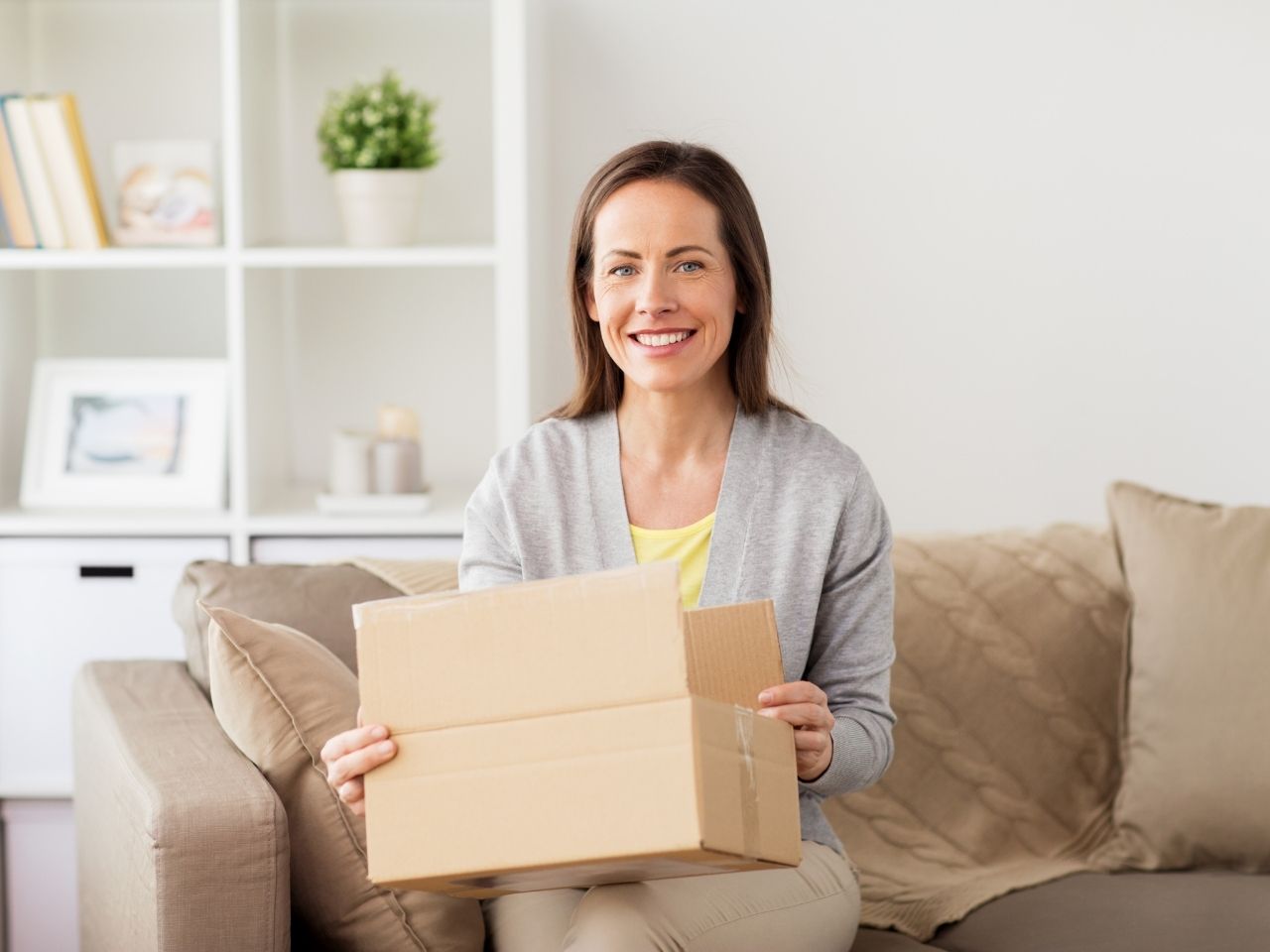 Woman unboxing package