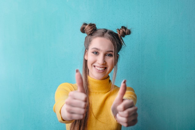 Woman wearing yellow turtleneck sweater