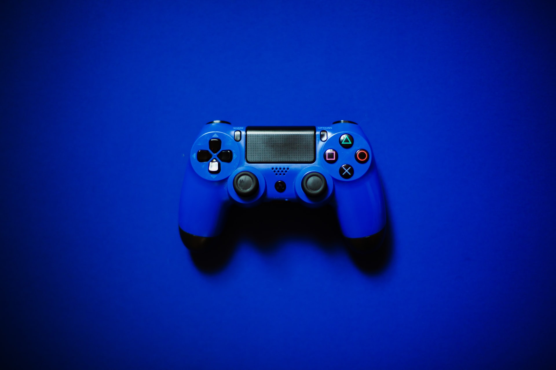Blue controller on a blue background