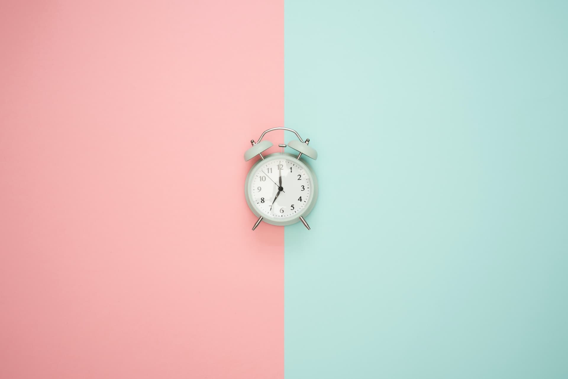 clock on pink background blog post