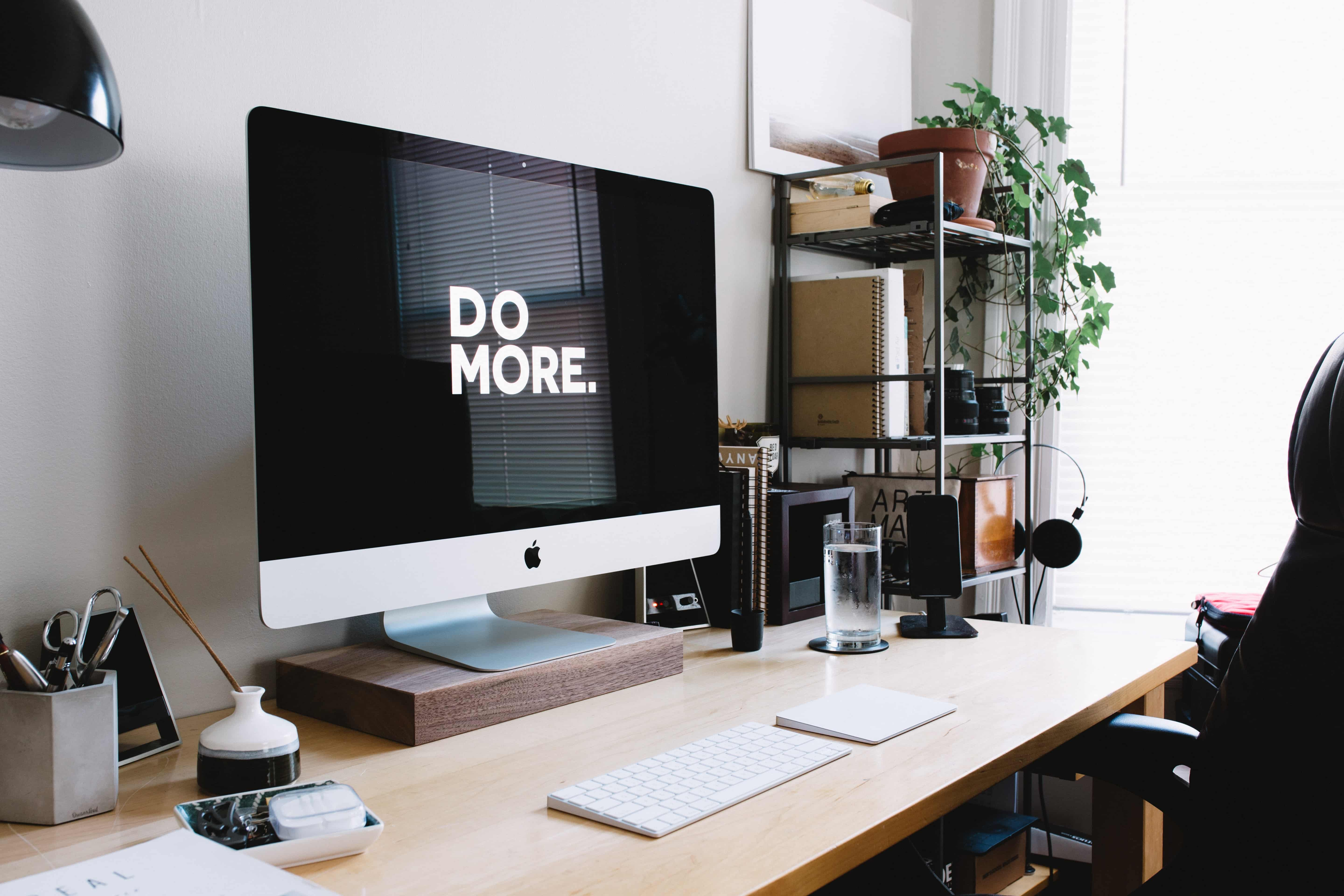 iMac on desk with keyboard