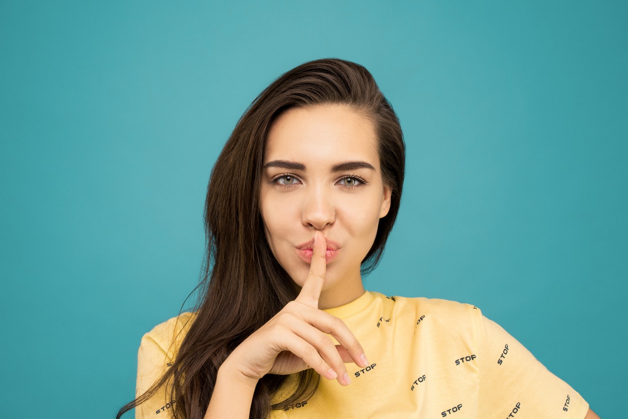 Woman in yellow doing the quiet pose