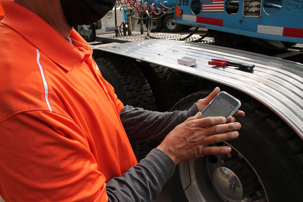 Tenna Mechanic Installing a Tenna Tracker in the Field