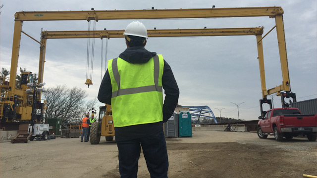 Construction Worker in the Field Using Asset Tracking Data to Make Informed Decisions