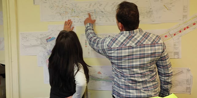 Workers planning out a construction site project