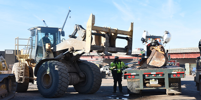 Construction worker dealing with a mixed fleet of assets on a site