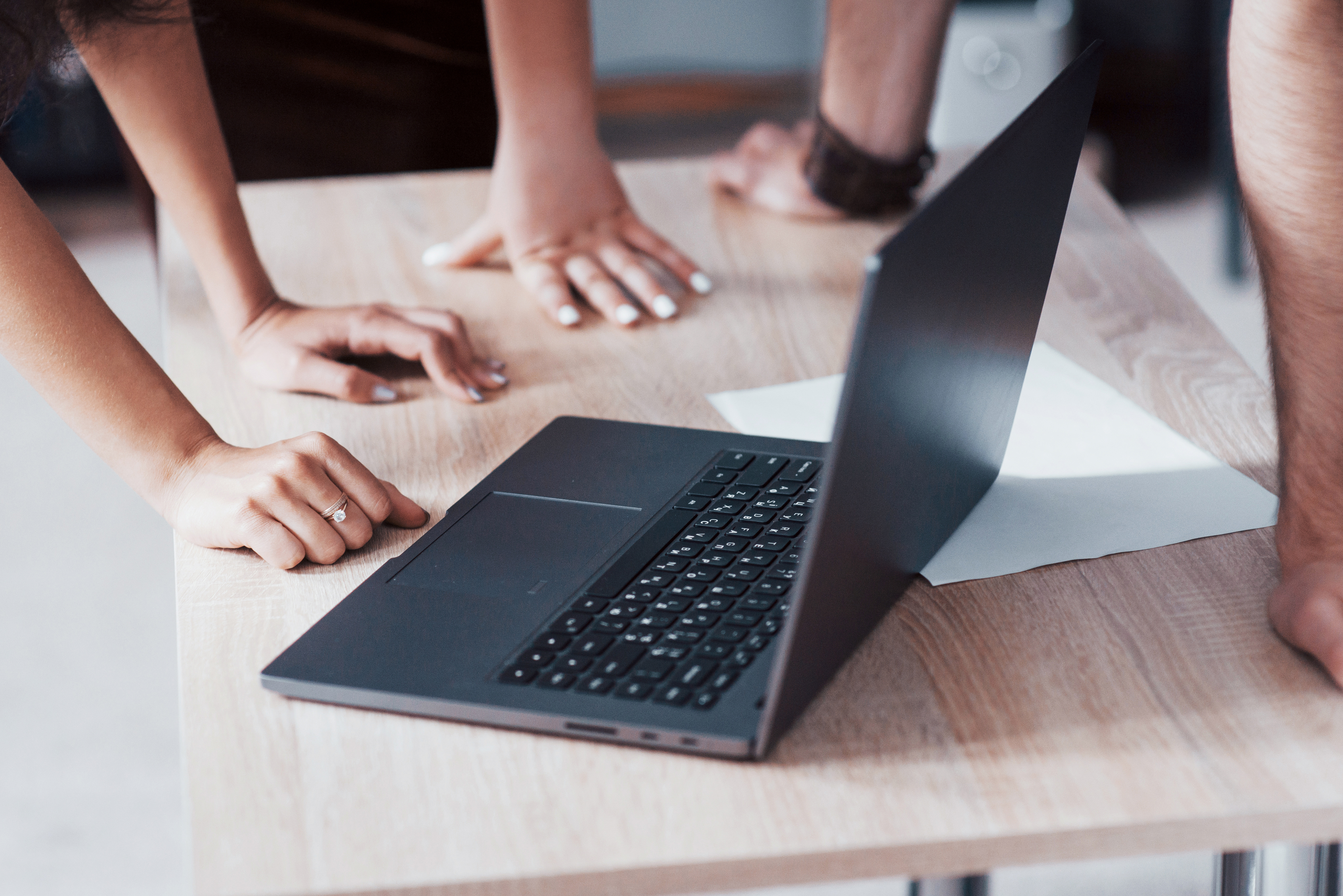 the-time-of-business-meetings-laptop-on-a-wooden-t-2JQWERU